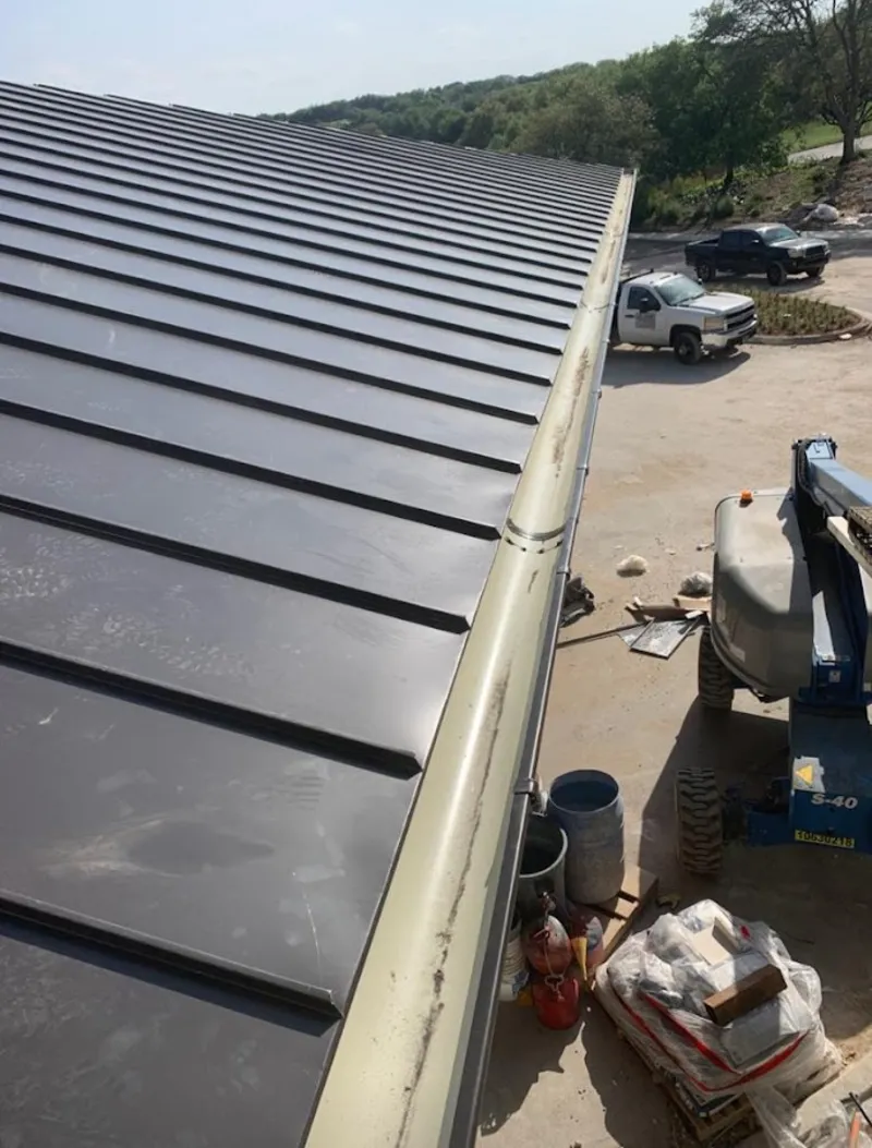 Standing seam panel and gutter detail on a metal roofing jobsite in St. Marys